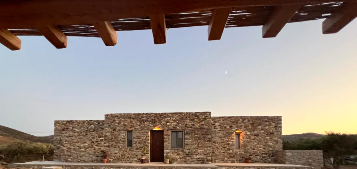 Ampelonas Suites main building against sunset photo